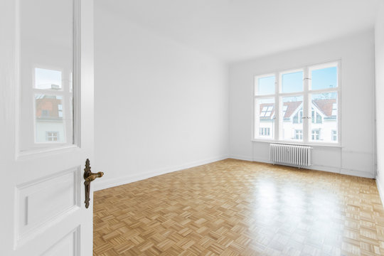 empty room with parquet floor after renovation