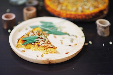 piece of traditional American pumpkin pie for Breakfast on Halloween blurred focus.