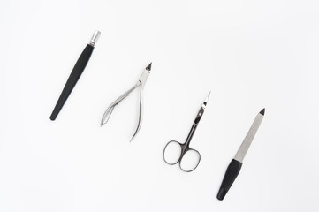 manicure instruments set on white background top view