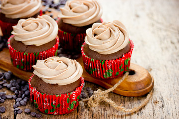 Christmas food - chocolate cupcakes decorated with cream cheese