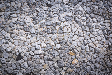 Texture and background of granite stone wall.