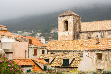 Horizontal view of historic buildings in the old town of Dubrovnik, Croatia, as seen from the medieval walls of the city.