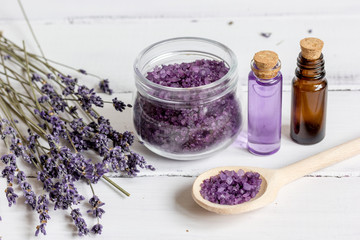 Obraz na płótnie Canvas organic cosmetics with lavender on wooden background