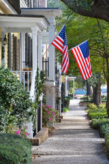 American Flags Flying on Town Sidewalk