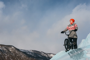 Girl on a bmx on ice.