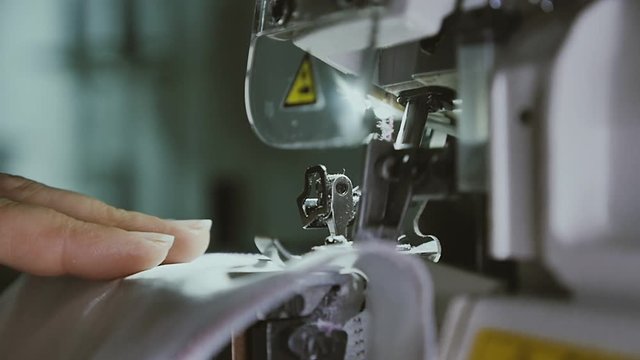 Sewing in slow motion. Close up.