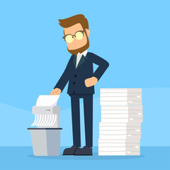 businessman shredding old files
