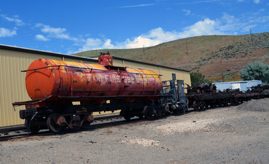Fototapeta na wymiar Old Red Fire Tanker Car/Railroad tanker car on train tracks.