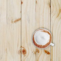 Cup of coffee on wooden table