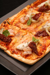 Pizza on the black background