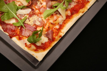
Pizza on the black background