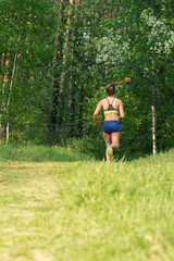 Young sports girl running, jogging