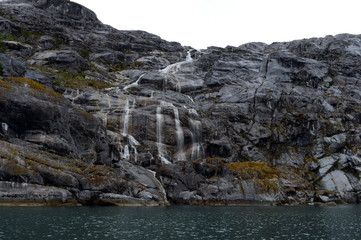 Fototapeta na wymiar Waterfalls Nena glacier on the archipelago of Tierra del Fuego.
