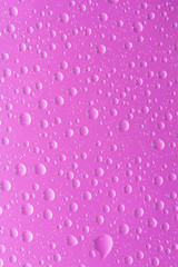 water drop on purple background vertical