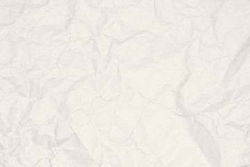 Crumpled light brown paper texture or paper background for design with copy space for text or image.