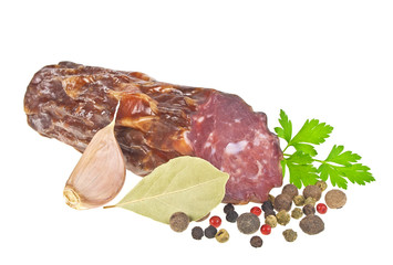 Fresh sausage, peppercorns, parsley, laurel leaf and garlic isol