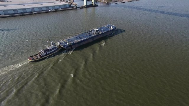 Aerial Footage of Barge and Tugboat on Delaware River Philadelphia PA At Walt Whitman Bridge