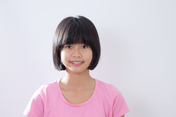 Asian young girl smile closeup gary background
