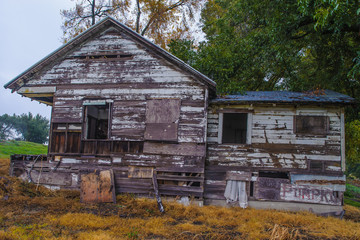 Delapidated old houses along highway 160 in California