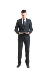 Young and confident businessman on white