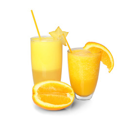 Orange and carambola smoothies on white background