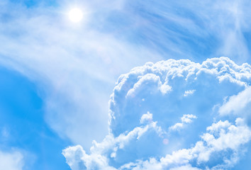 Blue sky with large cumulus clouds