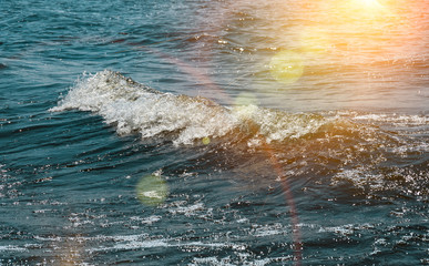 Waves and splashes in the water in windy weather
