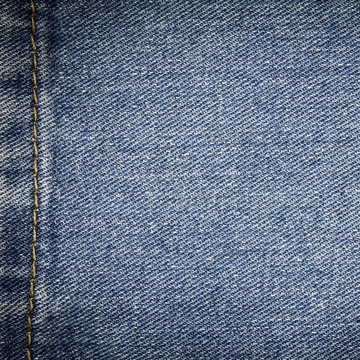 Denim jeans texture or denim jeans background with seam. Old grunge vintage denim jeans. Stitched texture denim jeans background of fashion jeans design.