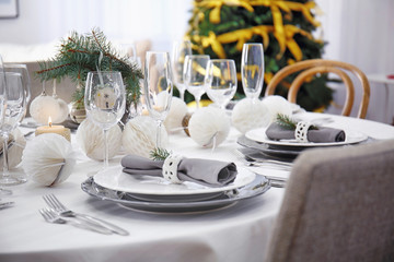 Table served for Christmas dinner in living room, close up view