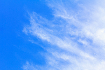 Blue sky background with white clouds. The vast blue sky and clouds sky on sunny day. White fluffy clouds in the blue sky.