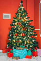 Beautiful new year room with decorated Christmas tree and gifts. The idea for postcards. Soft focus. Shallow DOF