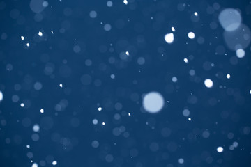 Falling Snow On The Blue Background