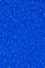 Naklejka na ściany i meble water drop on blue background