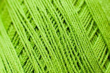 Green knitting thread texture, handiwork backdrop. Bright handiwork background, crochet iris string, Leisure, hobby, needlework concept