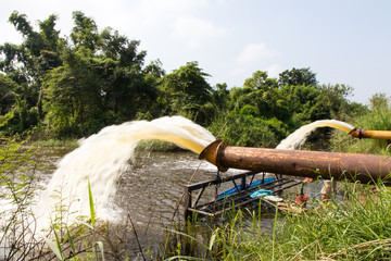 Water flowing from a large pipe.