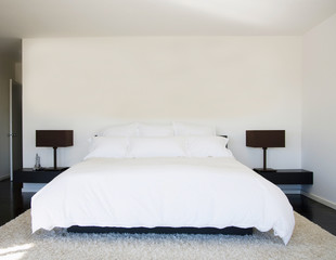 Interior of white and gray cozy bedroom