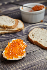 Sandwich with butter and red salmon caviar