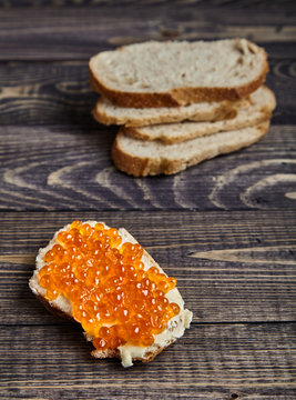 Sandwich with butter and red salmon caviar