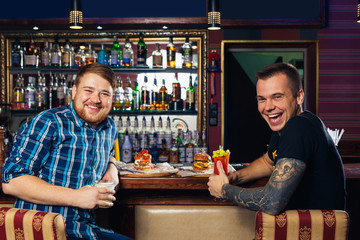 two young man posing at counter