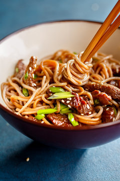 Asian soba noodles with beef and sesame