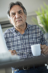 Portrait of man drinking coffee