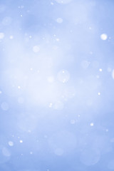 Abstract Blue Christmas Background with Real Snow. Blurred Snowflakes.