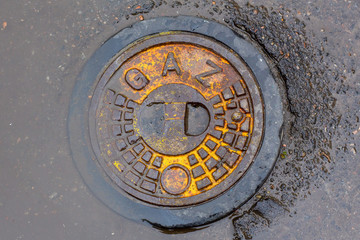 metal manhole cover with the inscription 