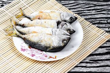 Ready side dish served  for Thai spicy sour dip   as deep fired streamed - mackarel  on wood.   