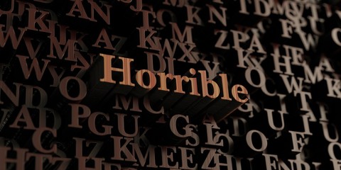Horrible - Wooden 3D rendered letters/message.  Can be used for an online banner ad or a print postcard.