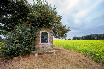 Fototapeta na wymiar chapel next to an tree