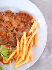 grilled steak with french fries