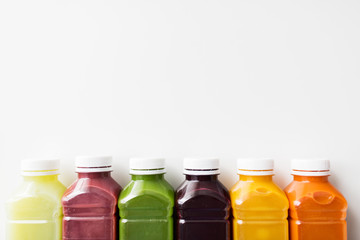 bottles with different fruit or vegetable juices