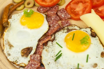 Fried Eggs on a plate. A hearty breakfast for athletes. Healthy food.
