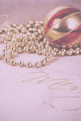 Festive gold Christmas decorations on fabric background Vintage